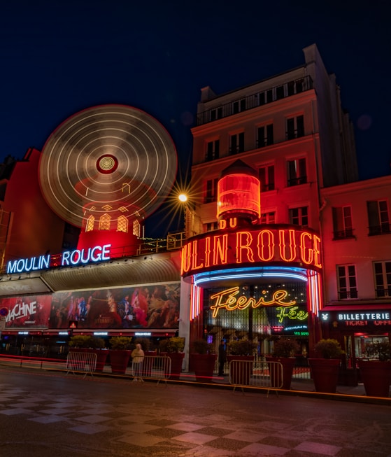 a large ferris wheel in front of a building