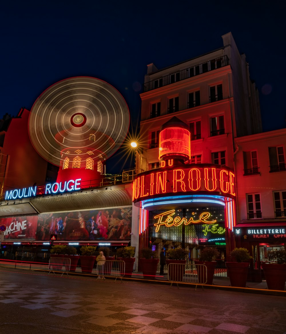 a large ferris wheel in front of a building