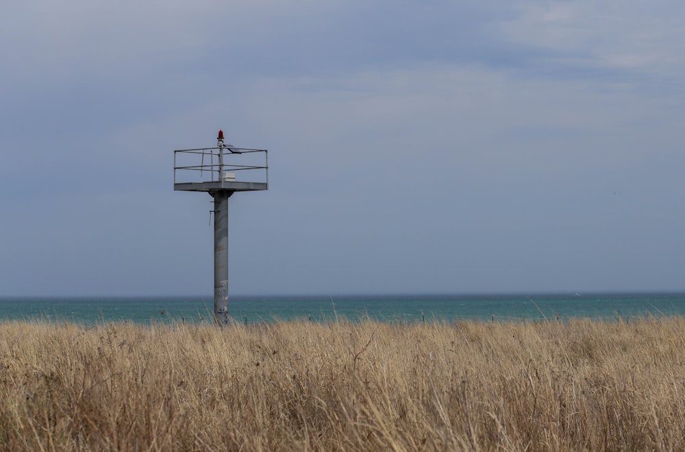 a wooden structure in a field