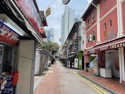 Front view of a commercial shop house with signage space.