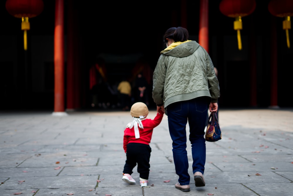 a person and a child walking