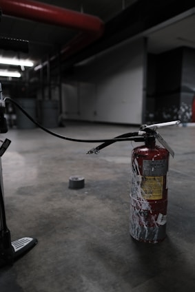 Technician performing maintenance on a Novec 1230 fire suppression system in a commercial building.