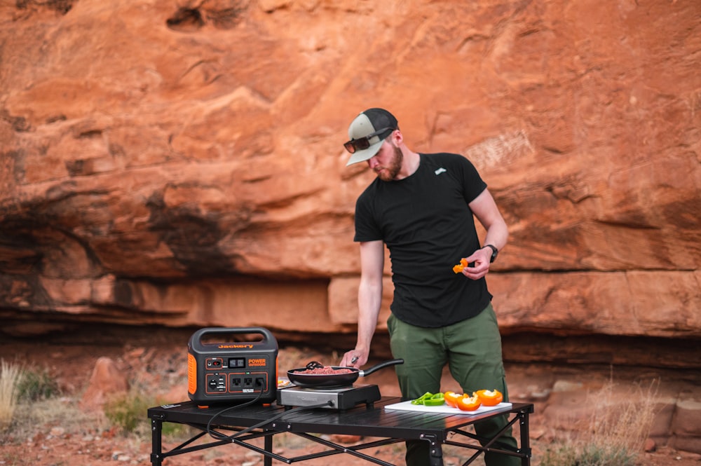 a man cooking outside