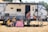 a group of people sitting outside a camper