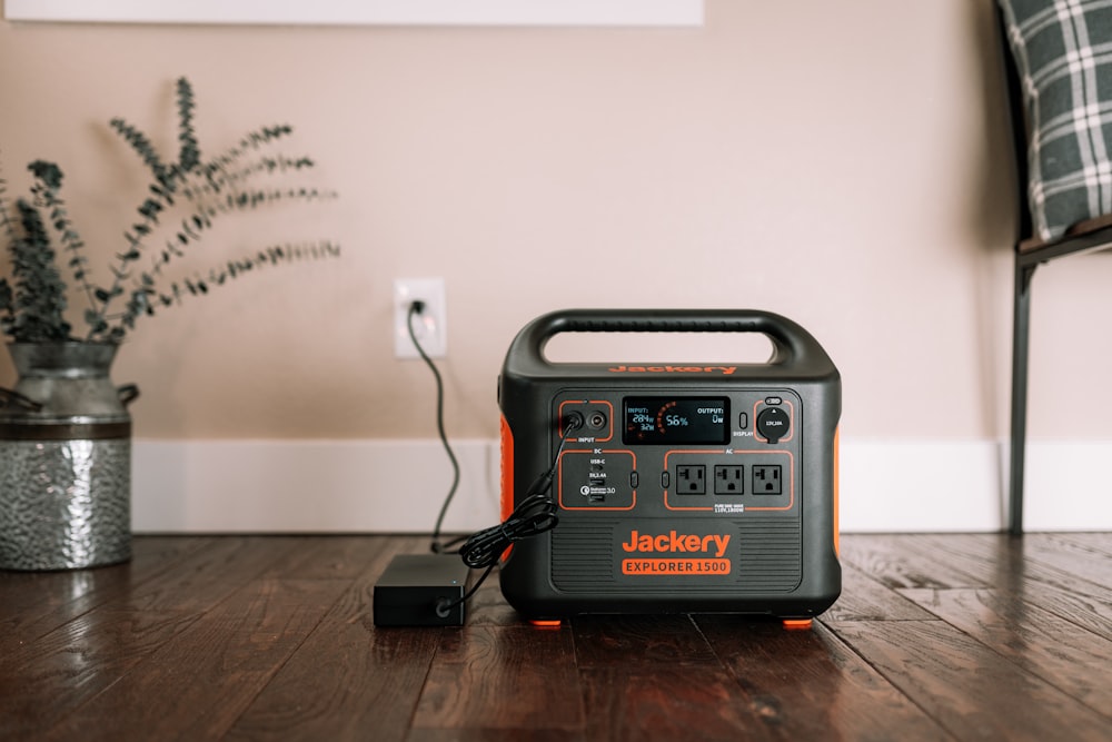 a black and silver radio on a wooden table