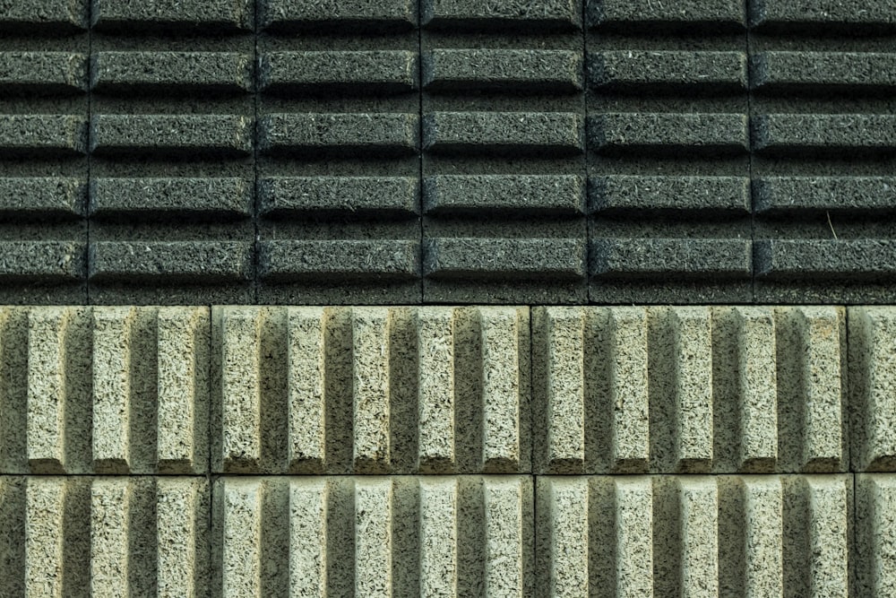 a close up of a black and white brick wall