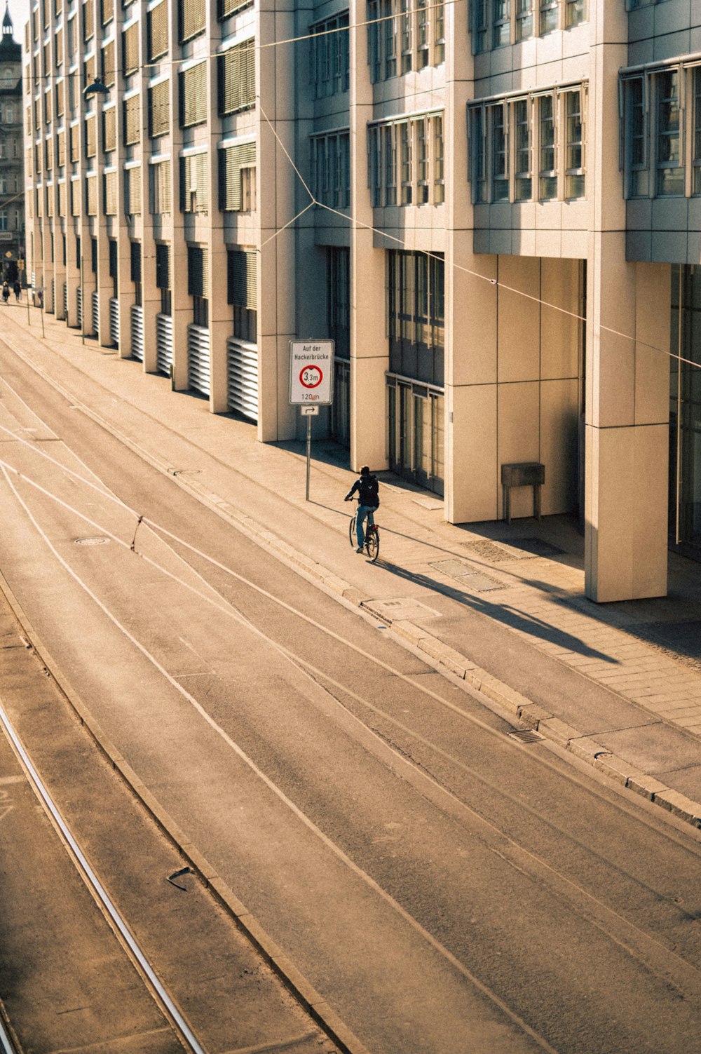 a person riding a bicycle on a street