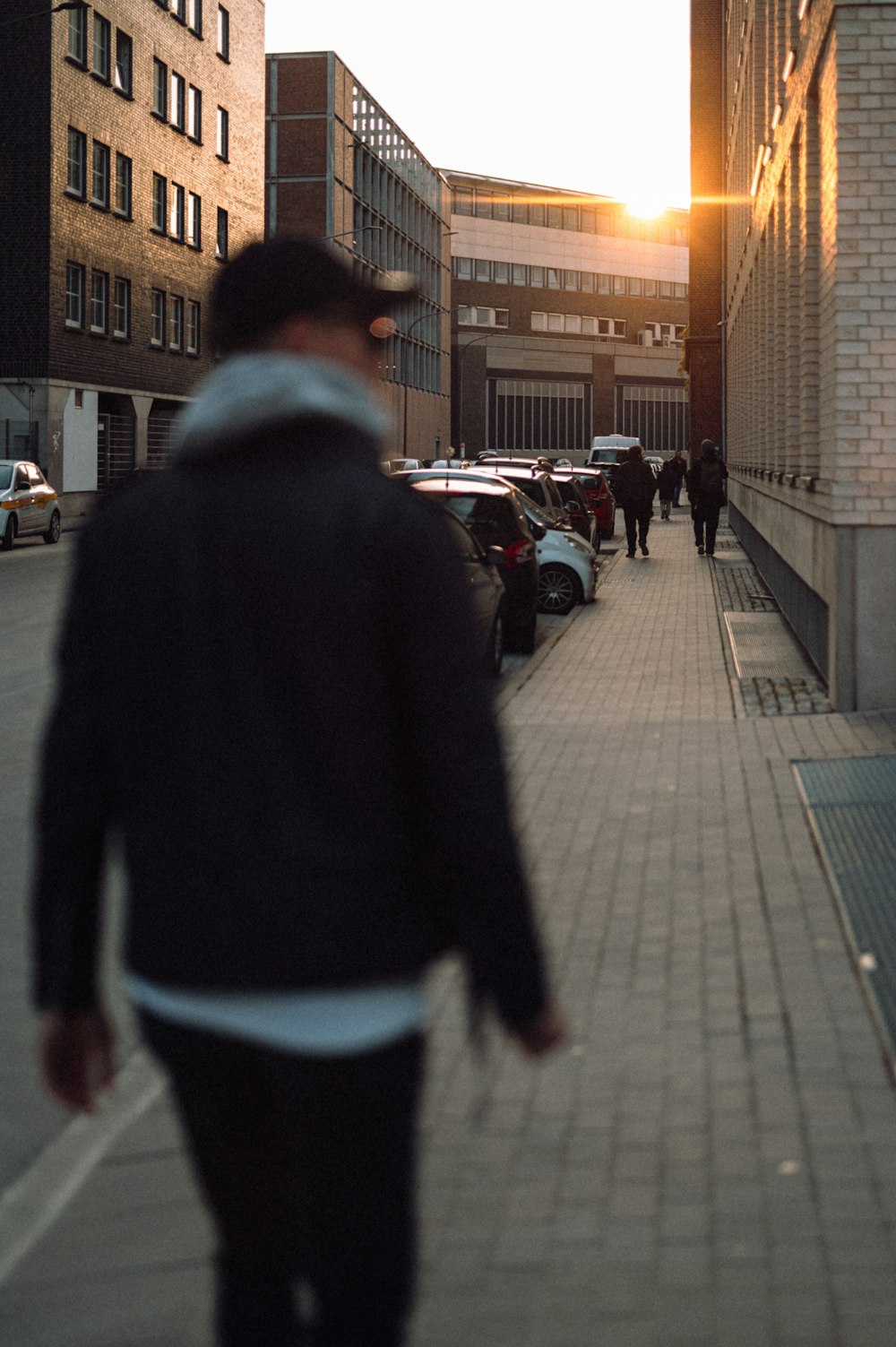 a person walking on a sidewalk