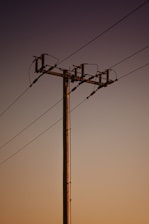 a telephone pole with wires