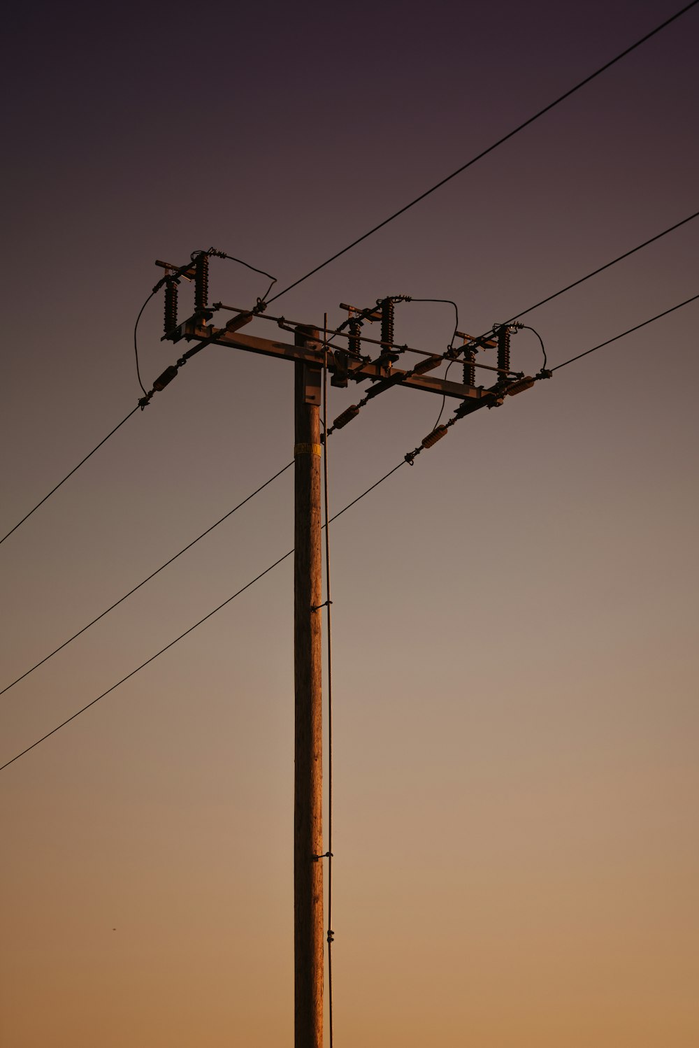 a telephone pole with wires