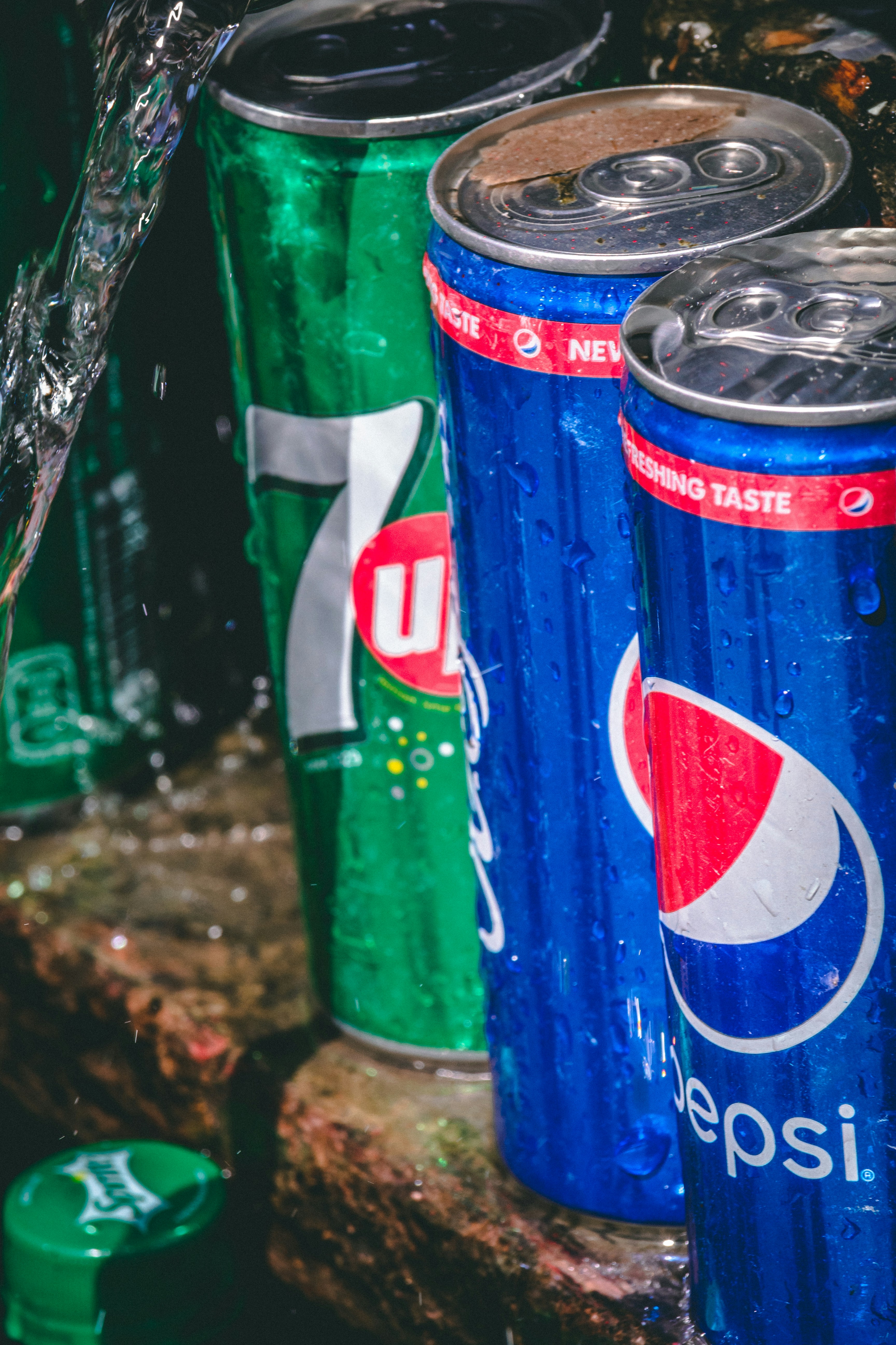 A group of cans photo Free Beverage Image on Unsplash