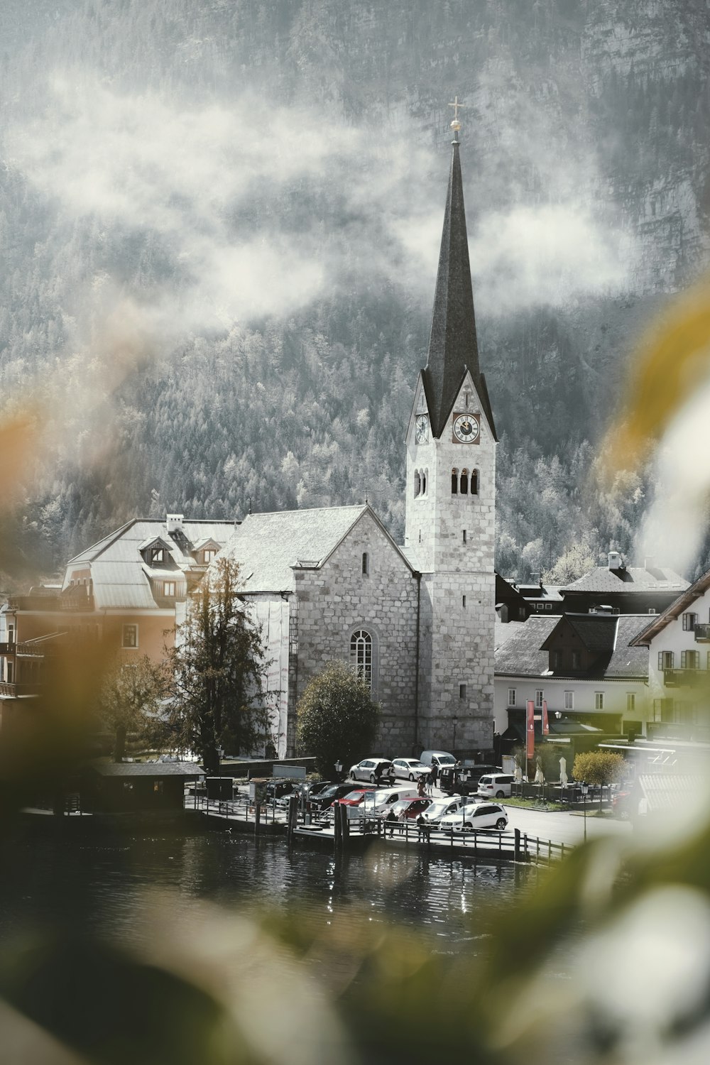 a building with a tower and a body of water in front of it