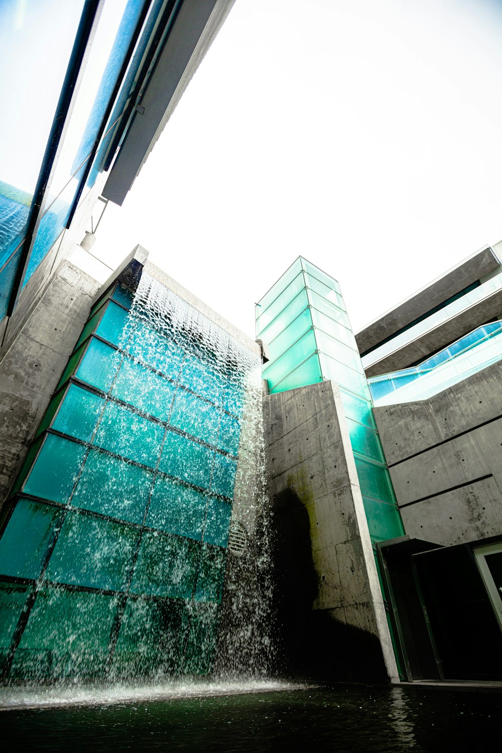 a building with a waterfall