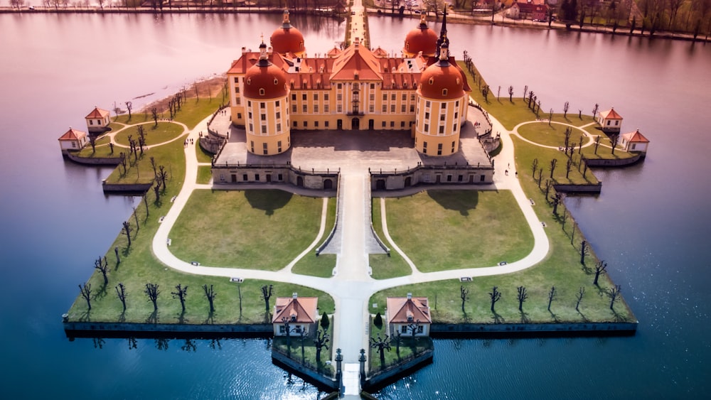 a building with a dome on top of a body of water