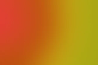 A shifting gradient background with smooth transitions of warm colors.