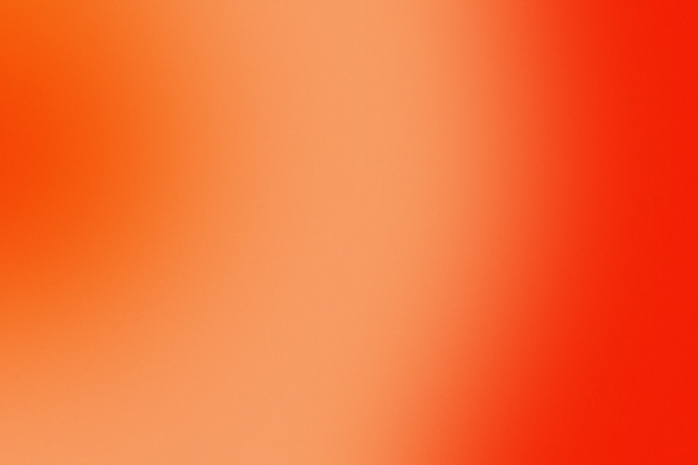 a close up of a red and orange background