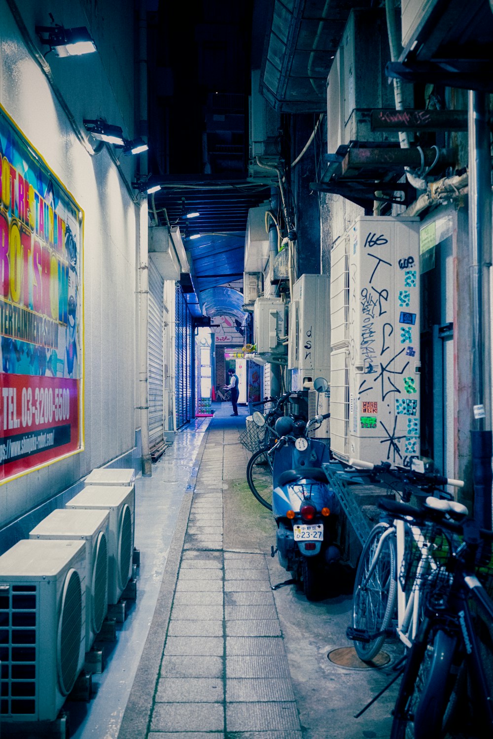 a scooter parked in a alley