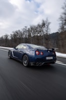 a blue sports car on a road Motor insurance