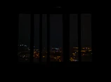 Night view of Cusco’s illuminated streets as seen from the suite’s large windows.