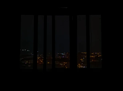 Night view of Cusco’s illuminated streets as seen from the suite’s large windows.