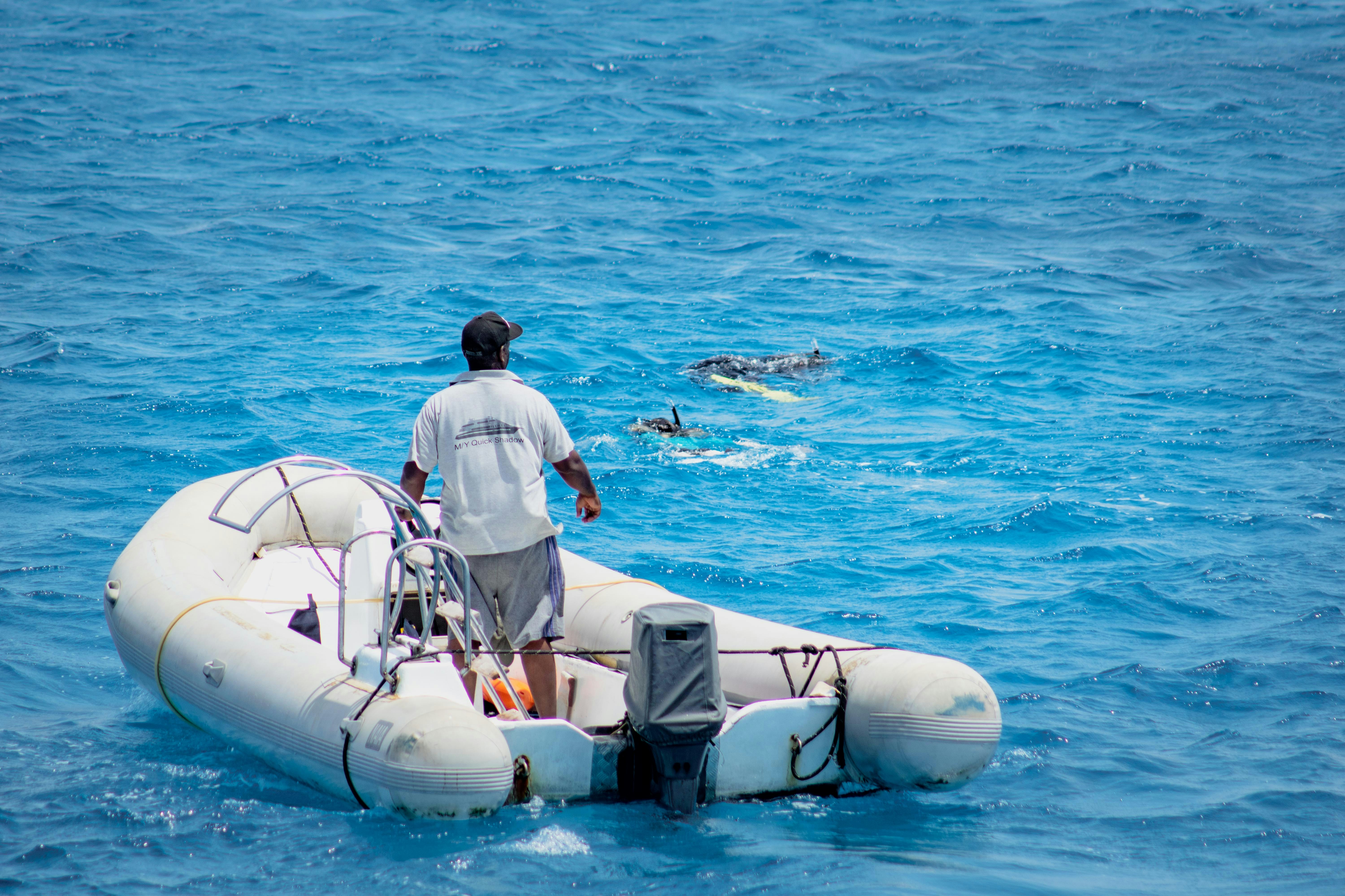 a person standing on a boat in the water