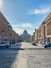 a street with cars and buildings on either side of it