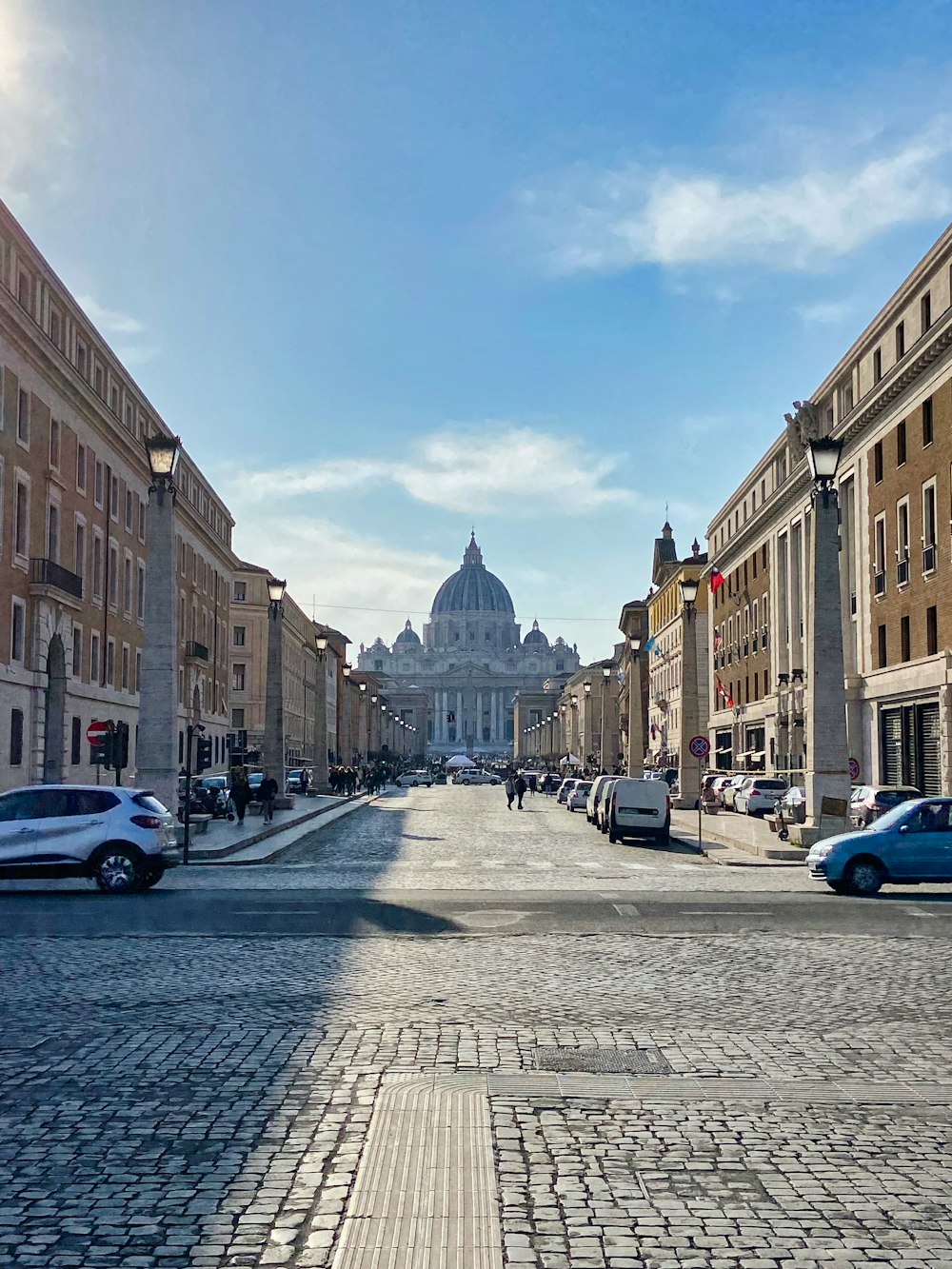 a street with cars and buildings on either side of it