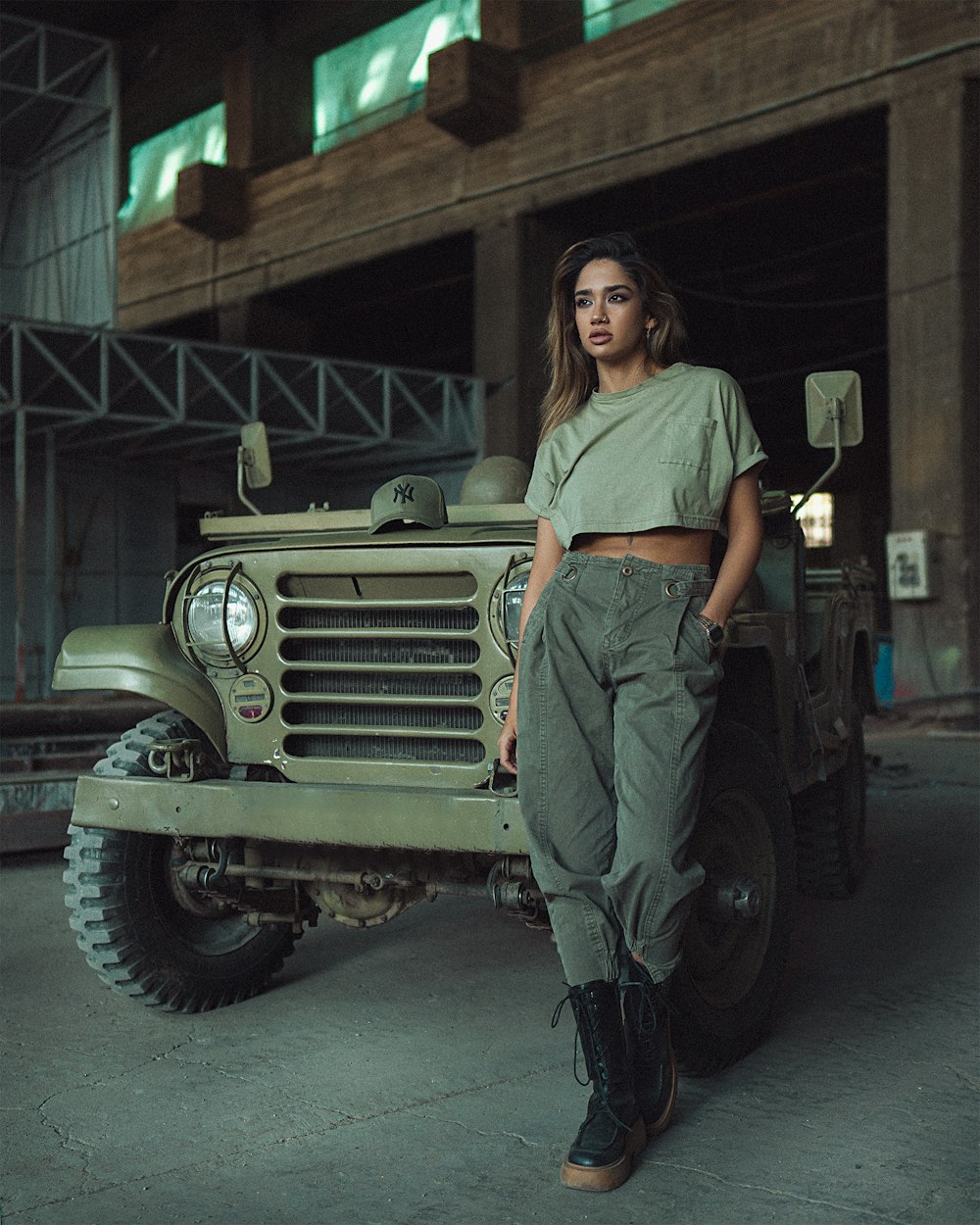 a person standing next to a jeep