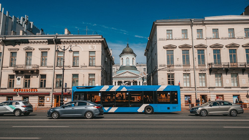 a bus and cars driving down a street