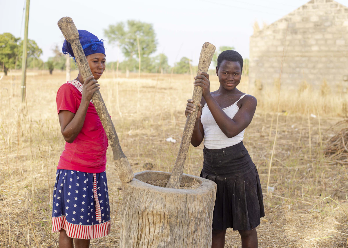Ghanaian farmers working together in the field during training