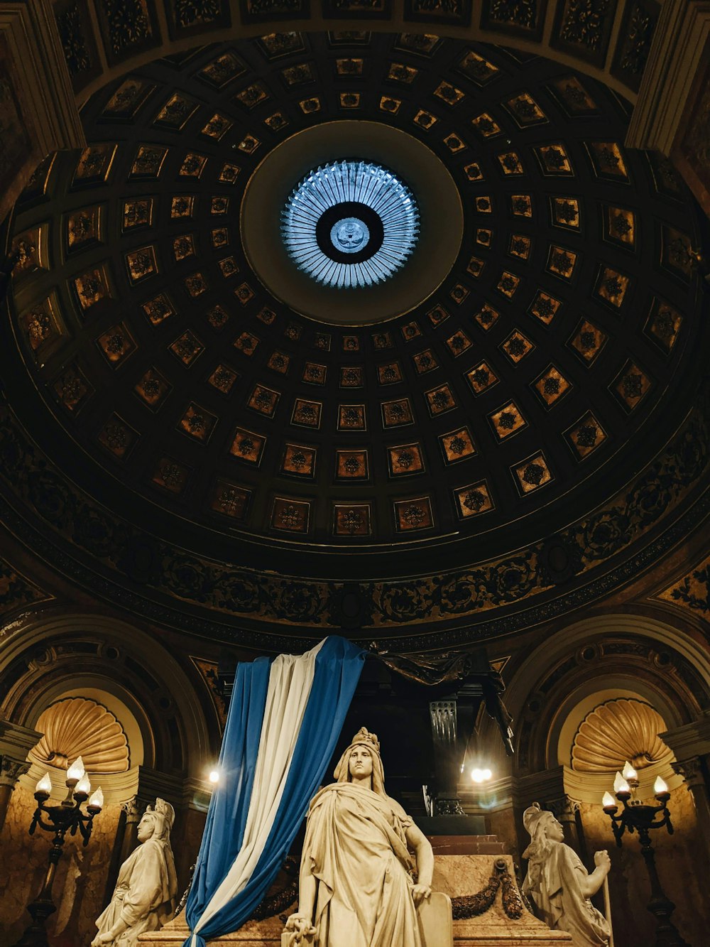 a large domed ceiling with statues
