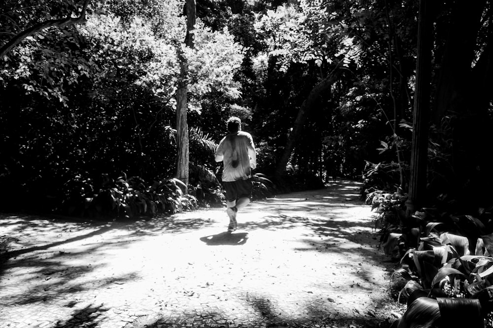 a person running on a path in the woods