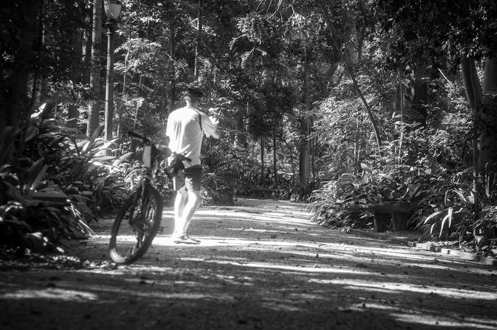 a person walking with a bicycle