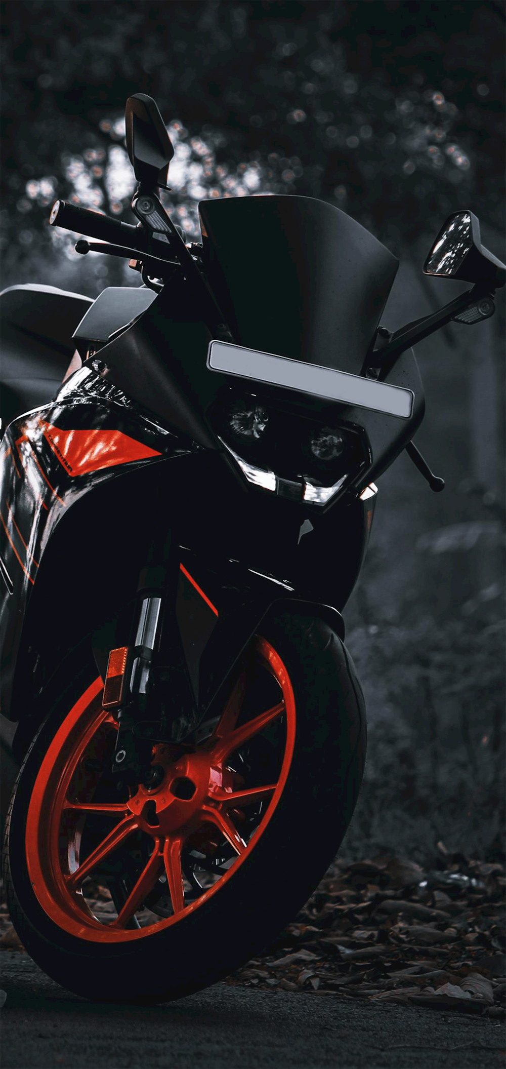 a black motorcycle parked on a road