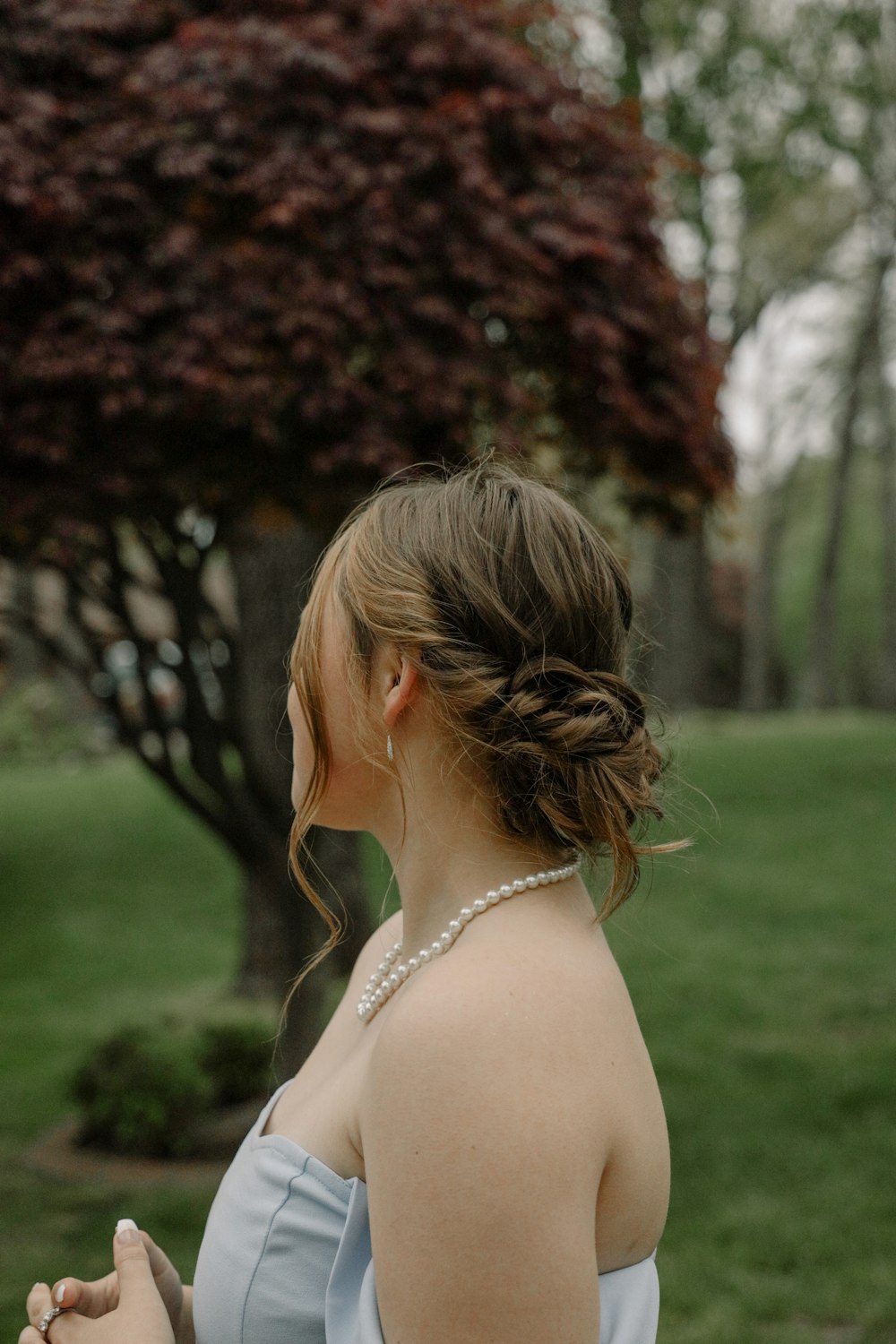 a woman with her hair blowing in the wind