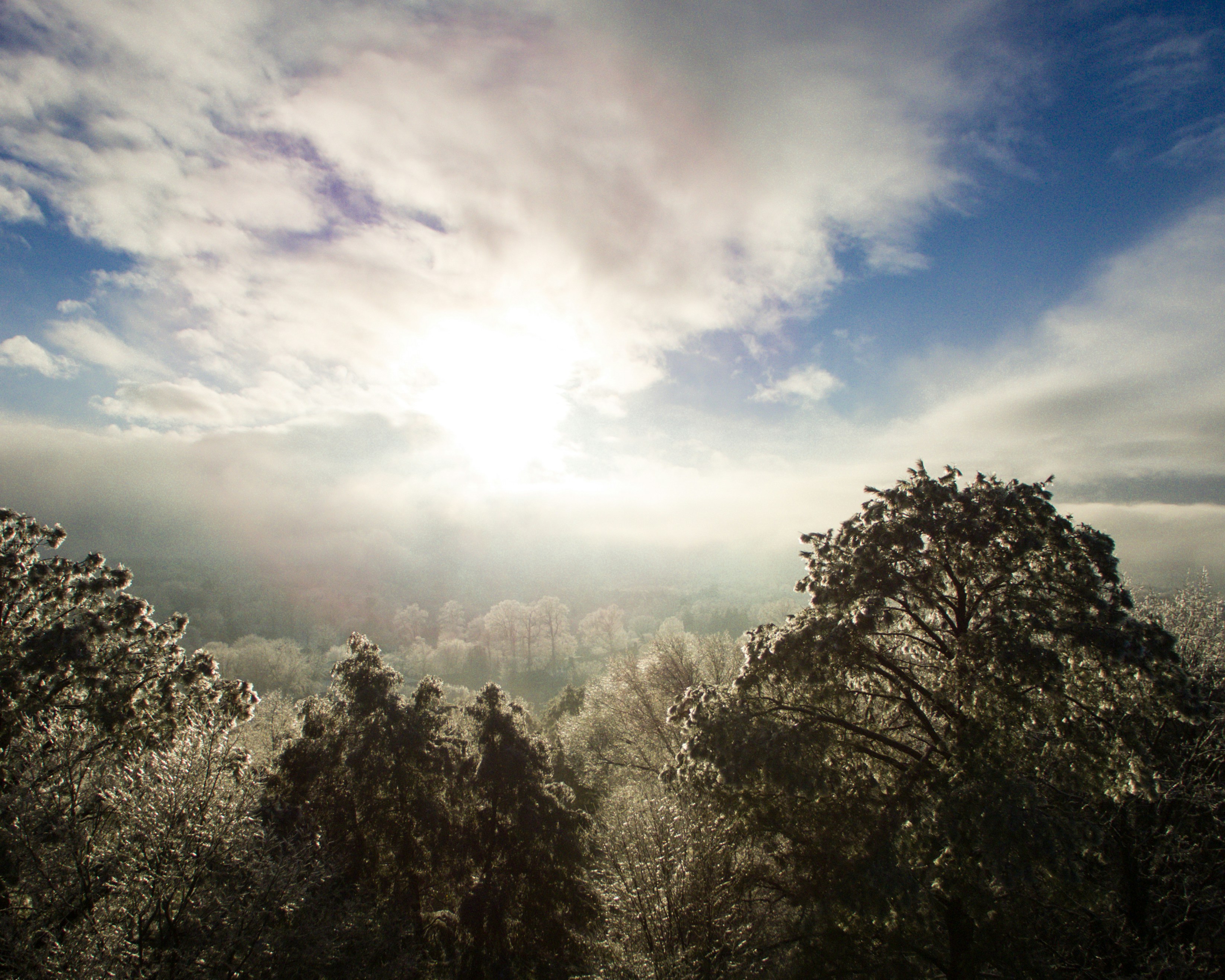 sun shining through clouds