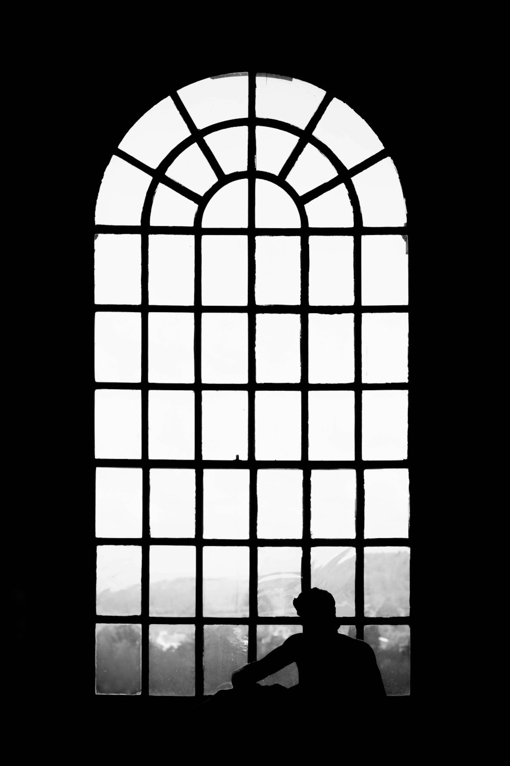 a person sitting in a window