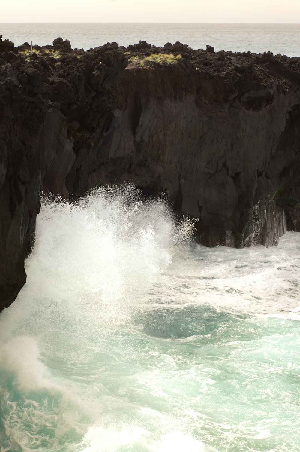 a waterfall over a cliff