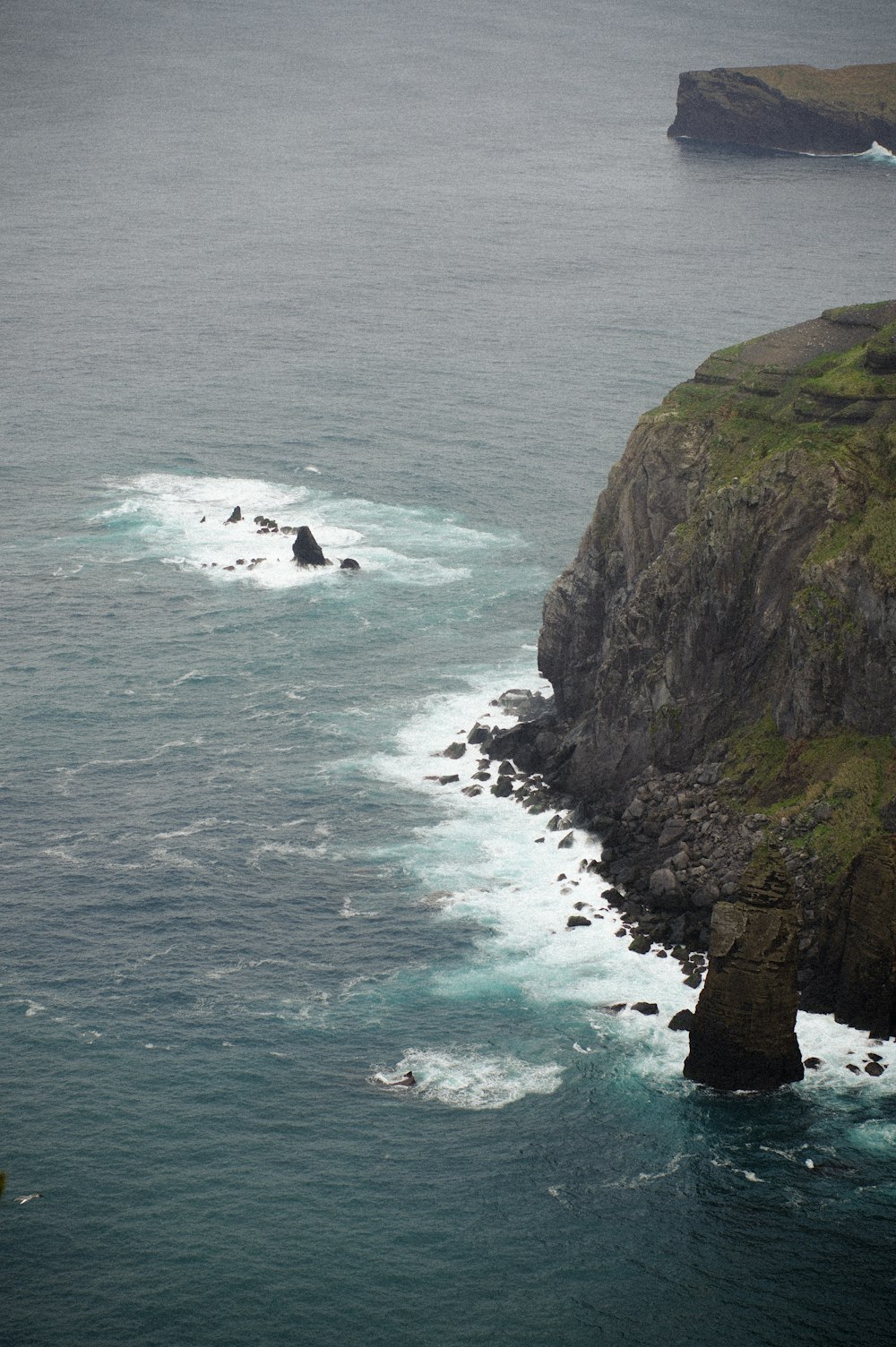 a group of people surfing in the sea