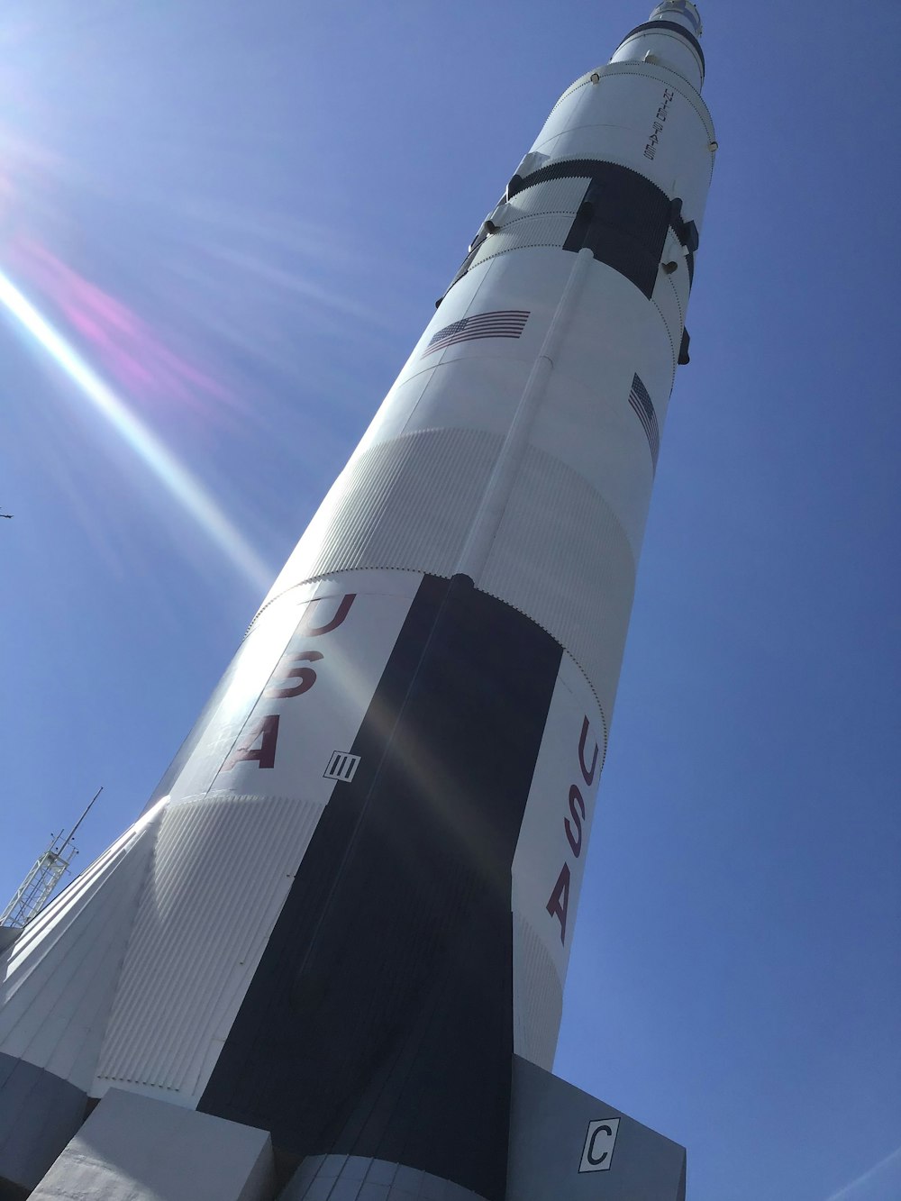 a rocket with a rainbow in the background