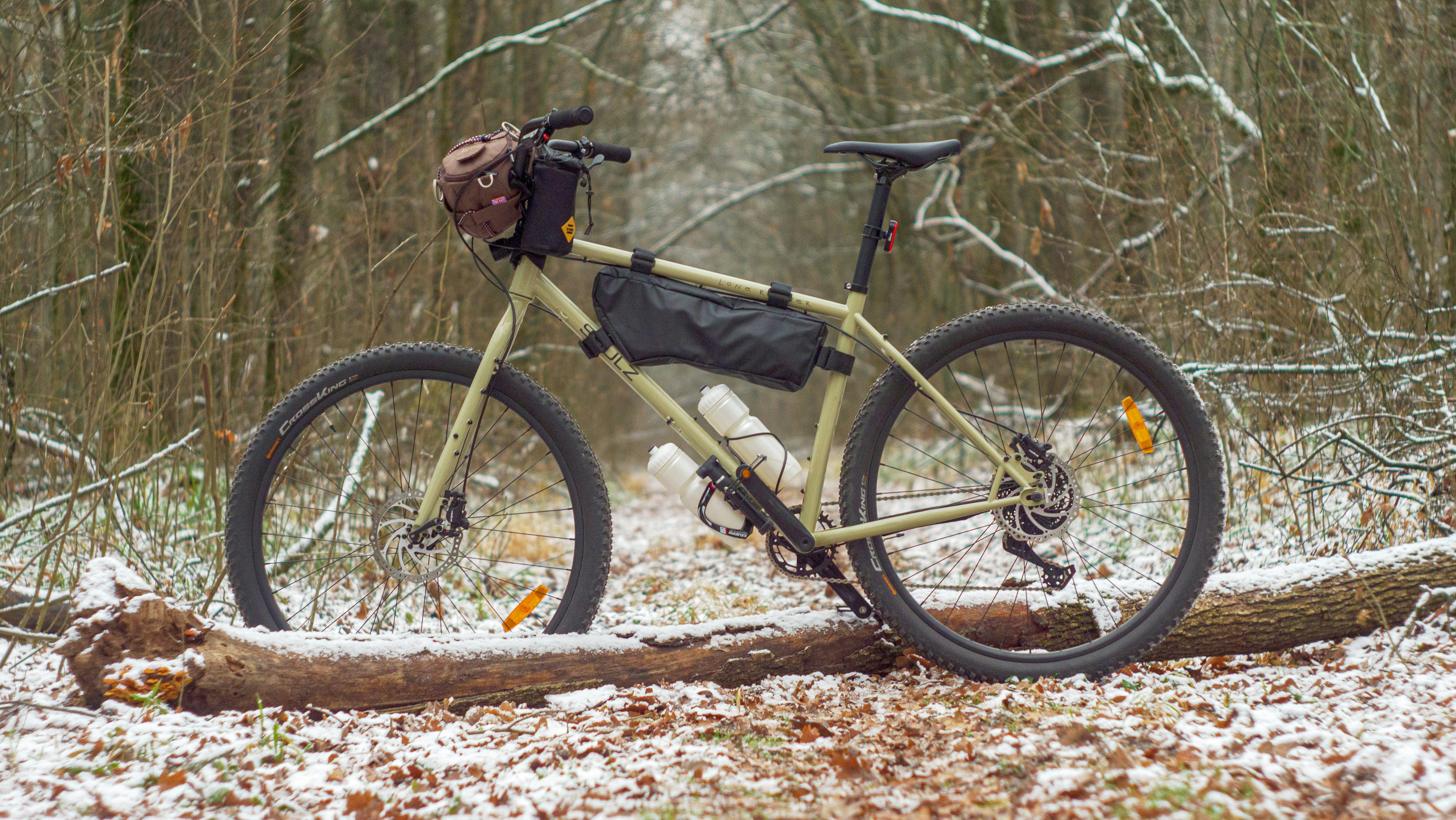 a bicycle parked on a log