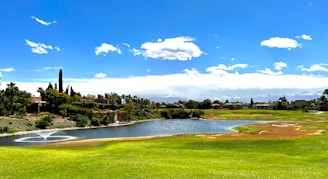 a golf course with a pond