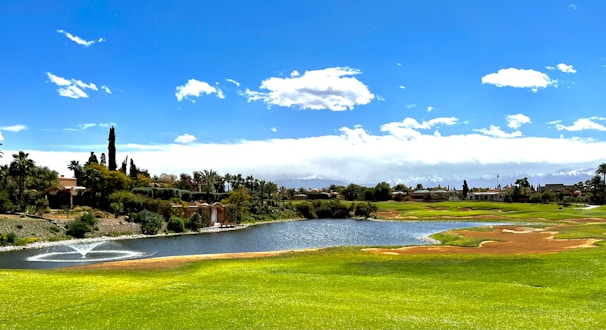 a golf course with a pond