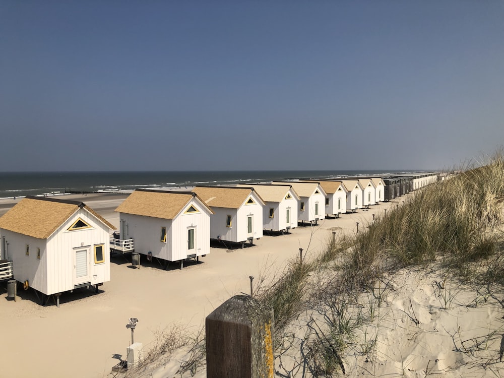 a row of houses on a beach