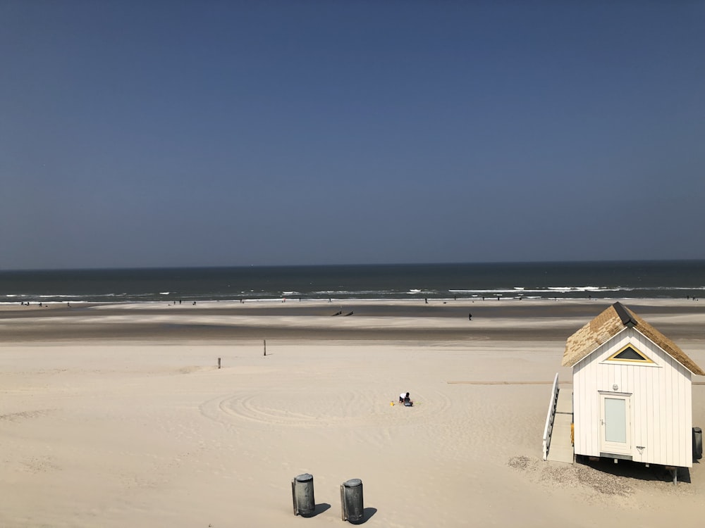 a small shack on a beach