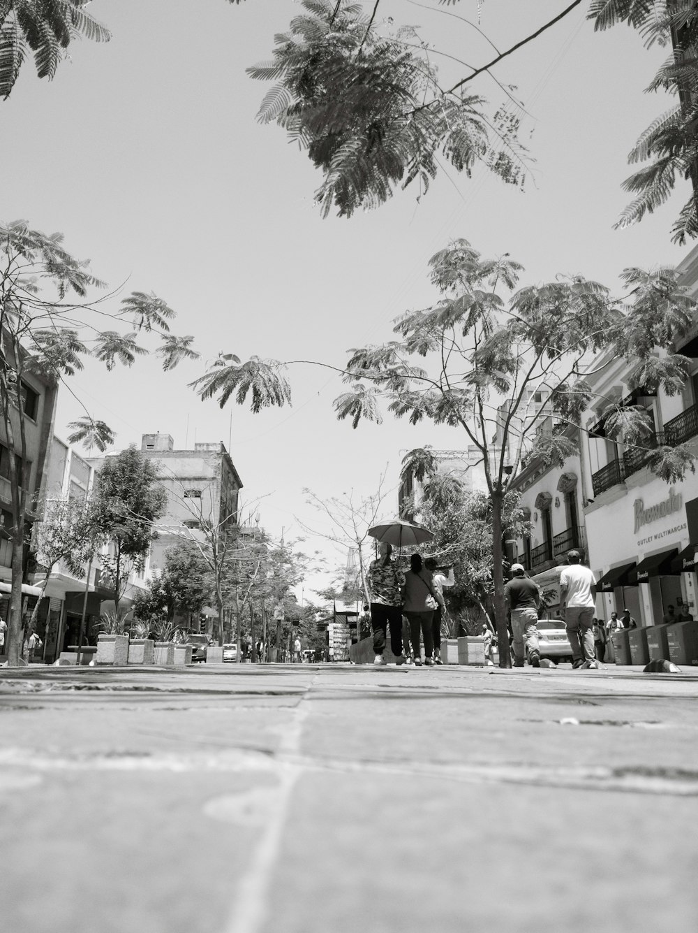 people walking on the sidewalk