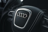 A dynamic Audi steering wheel in action.