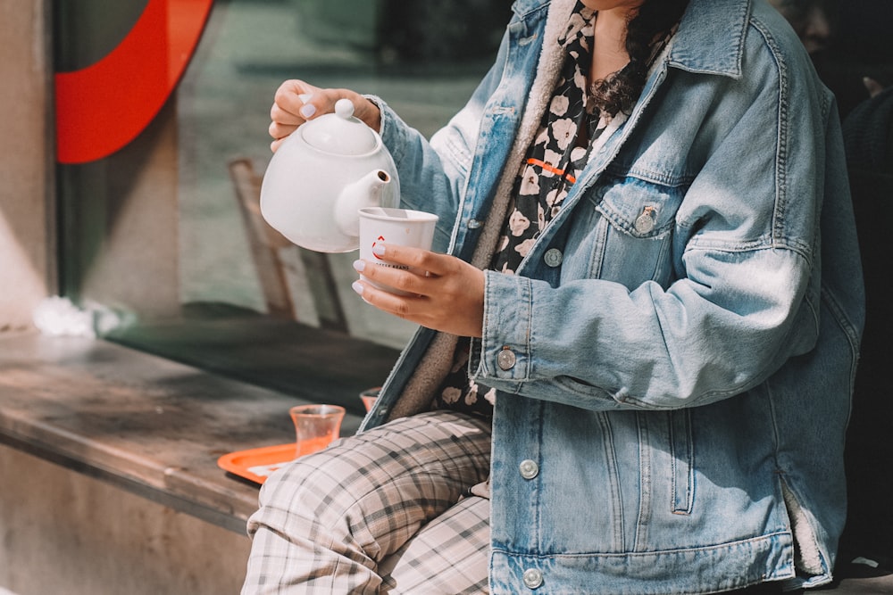 a person holding a cup