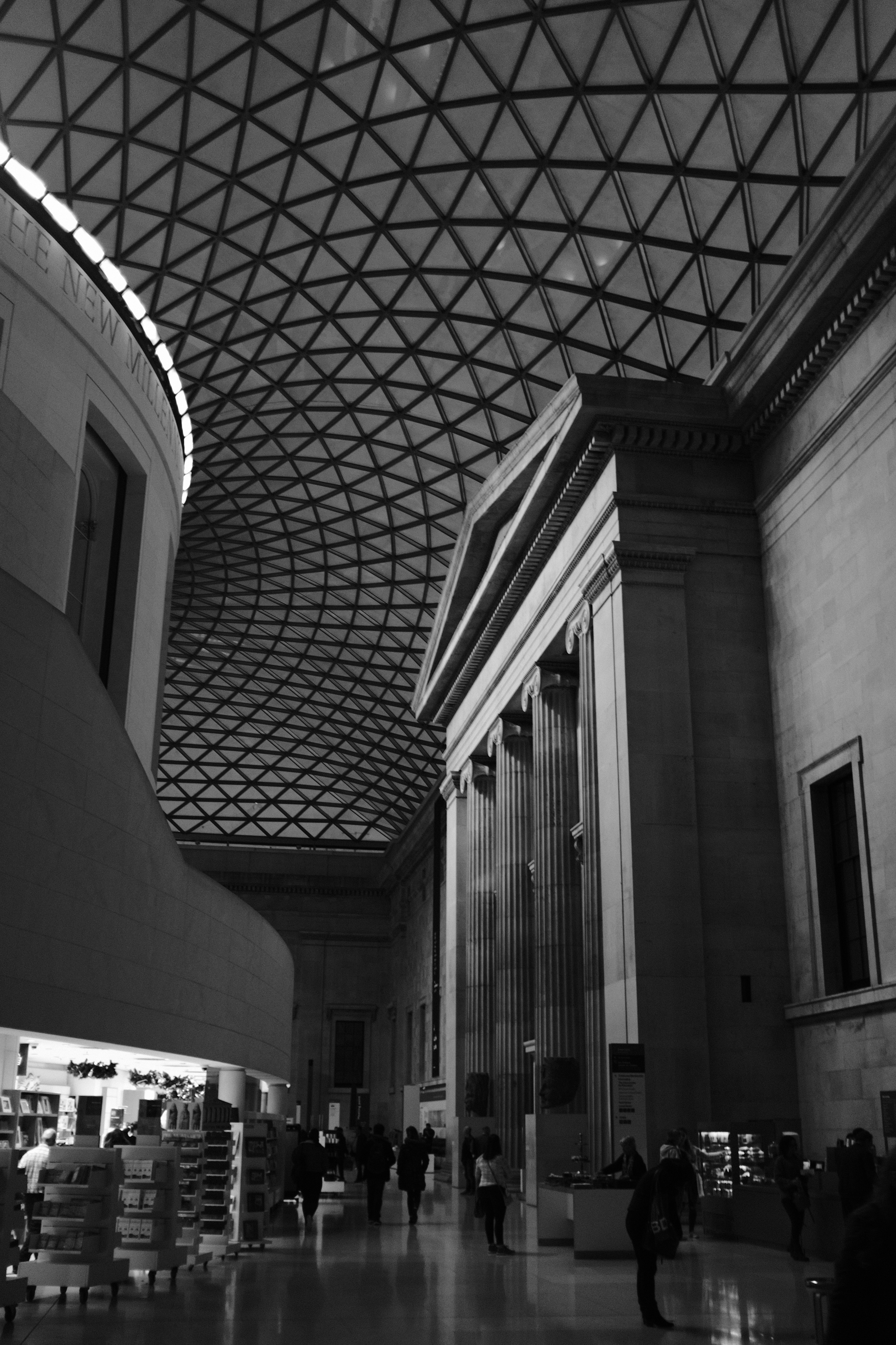Interior of British Museum, London. Giant Greek or Roman temple facade with pillars. Black and white photography, Fujifilm Acros.