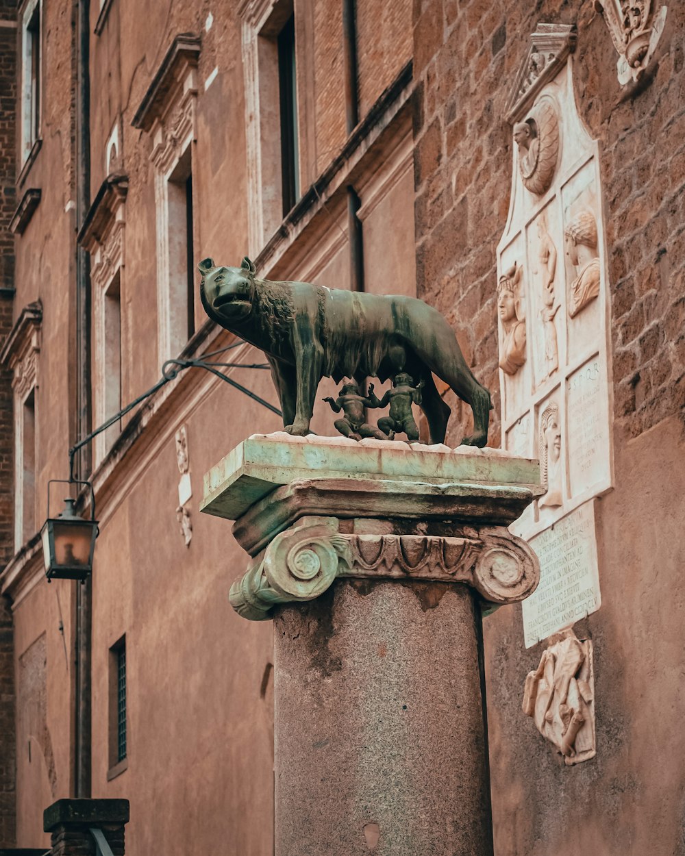 a statue of a bear on a pillar
